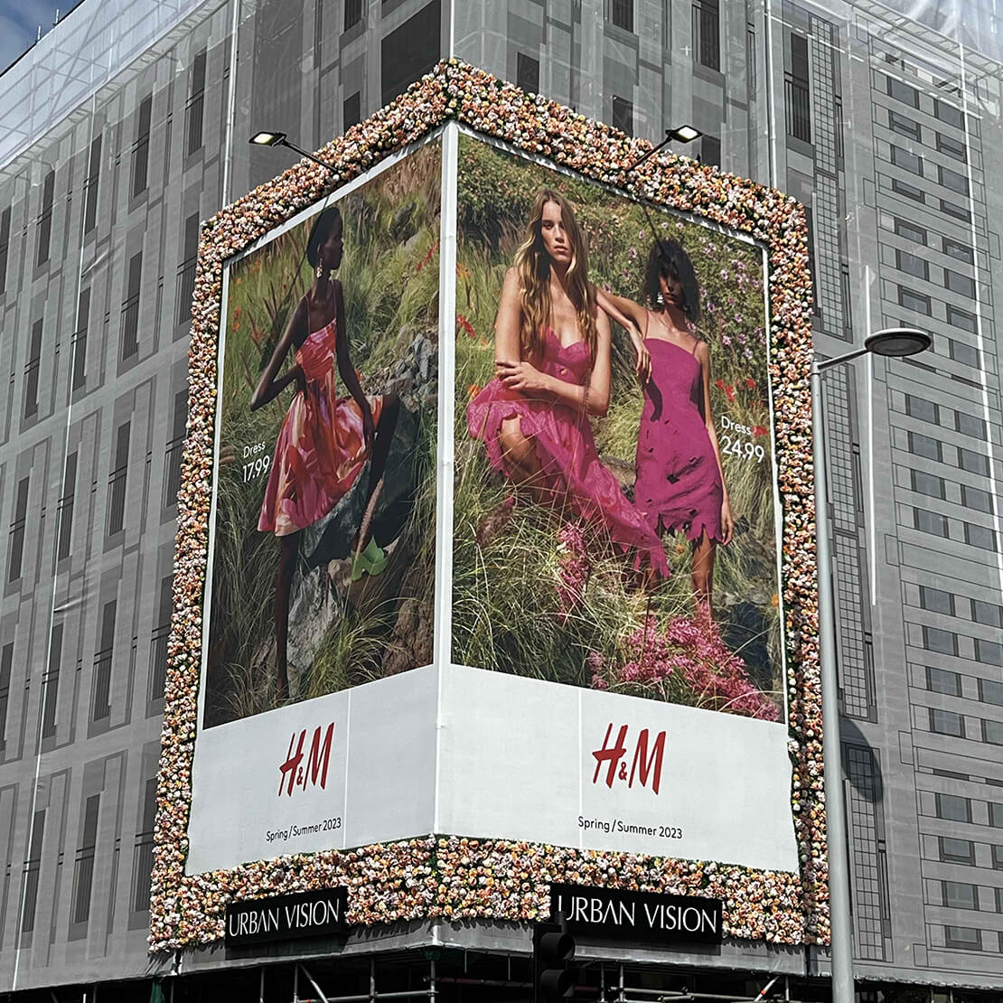 H&M store in central London featuring artificial flower and foliage wall tiles.